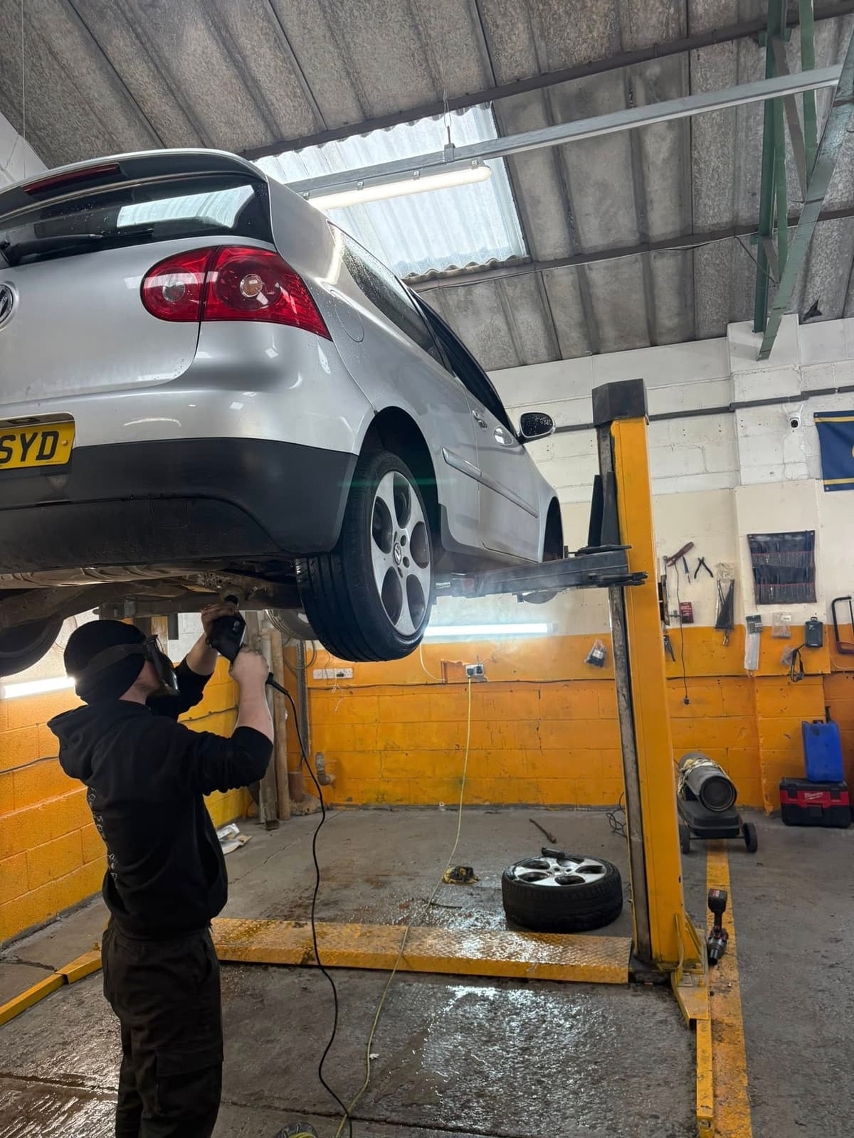 Mechanic working on a car